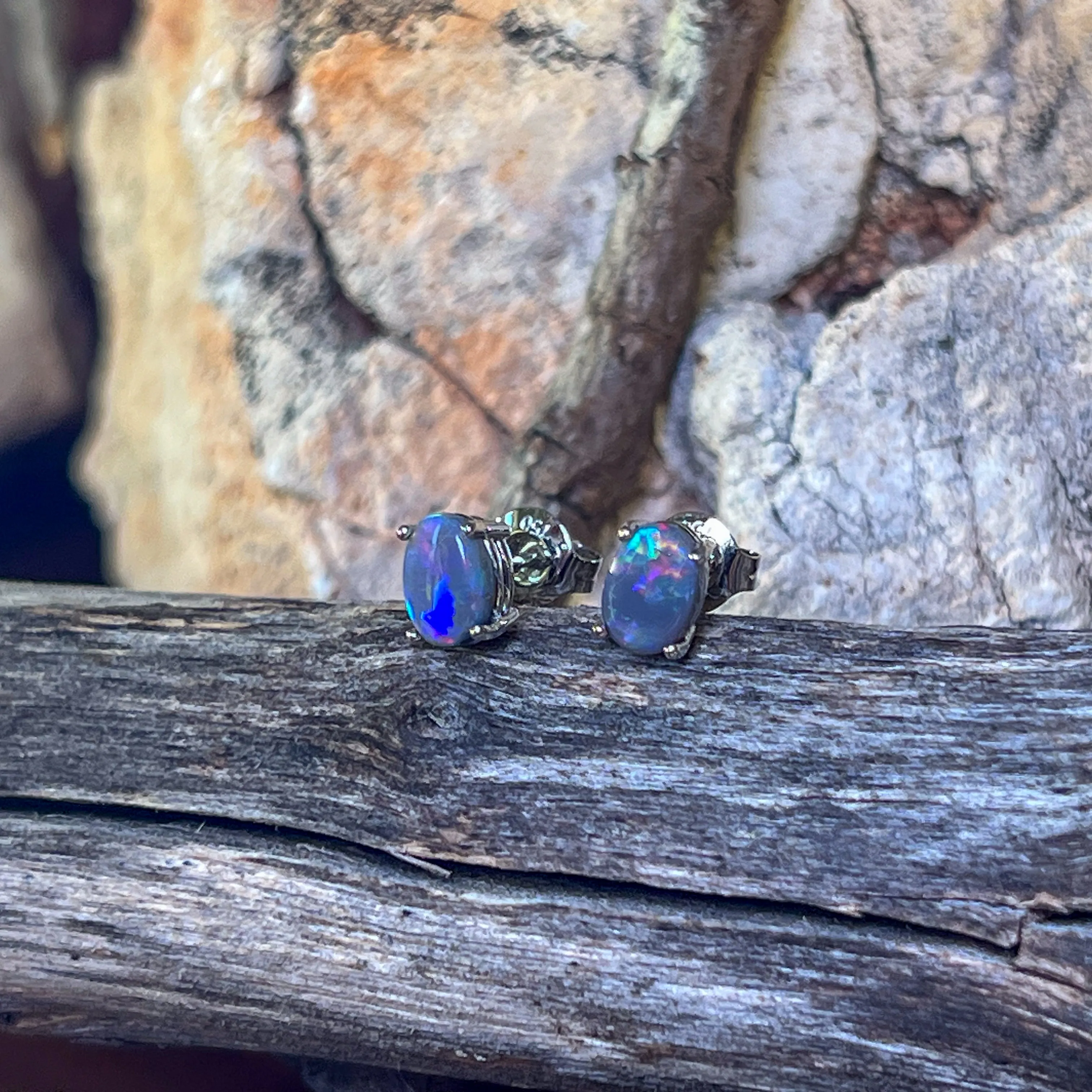 18kt pair of Black Opal Oval 1.16ct studs