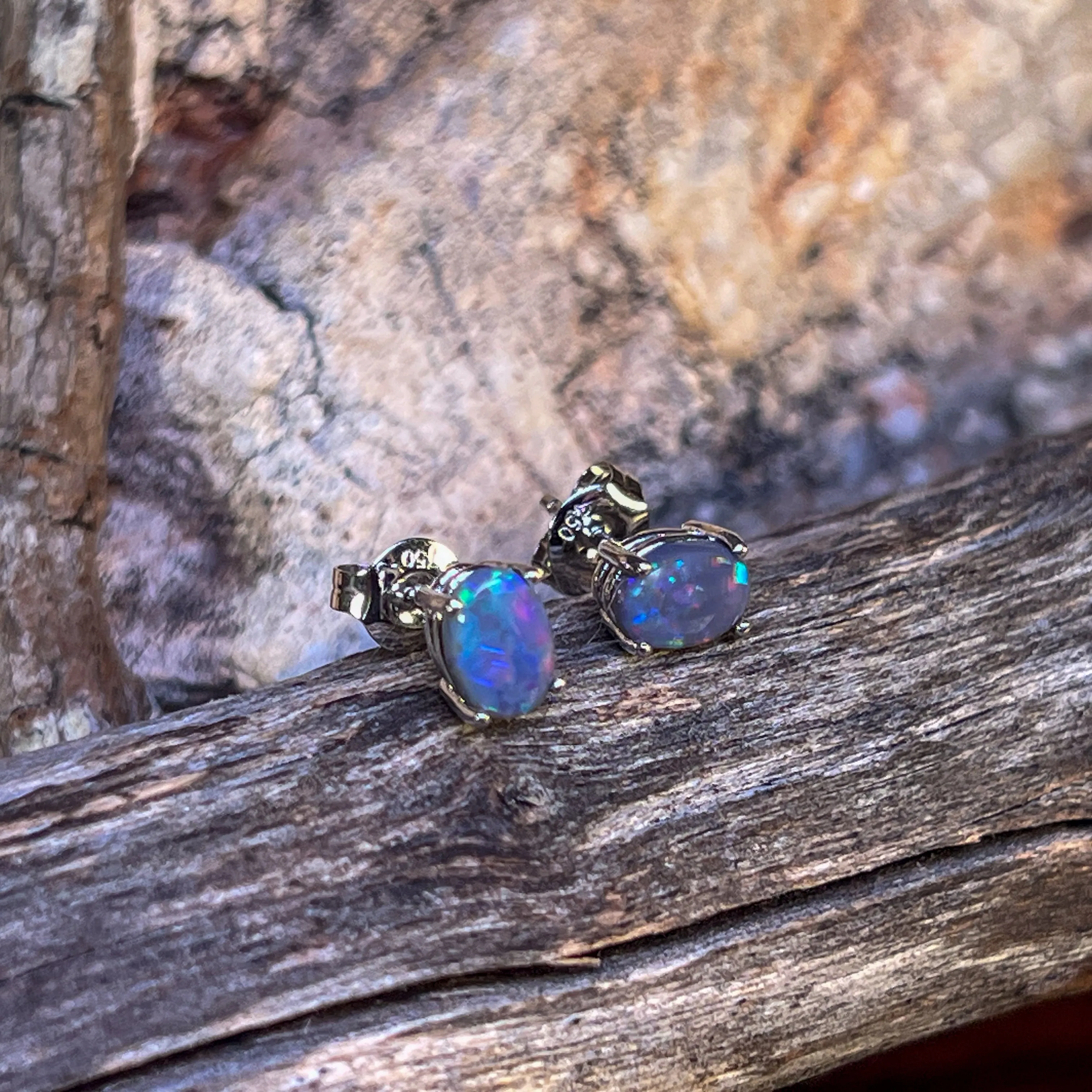 18kt pair of Black Opal Oval 1.16ct studs