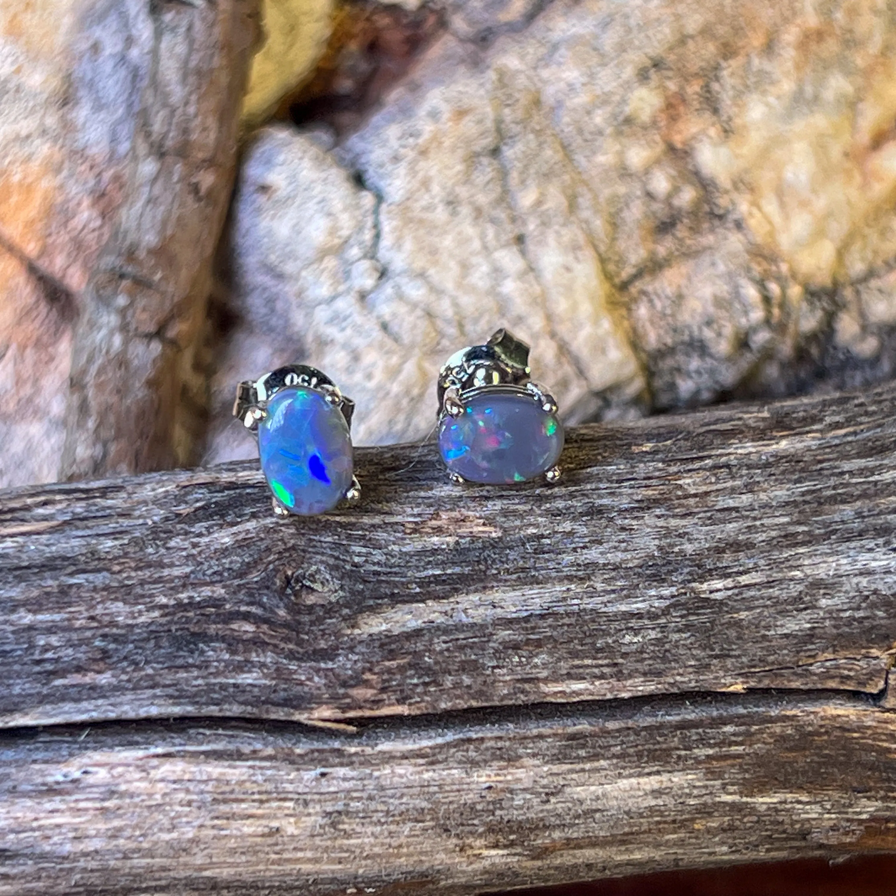 18kt pair of Black Opal Oval 1.16ct studs