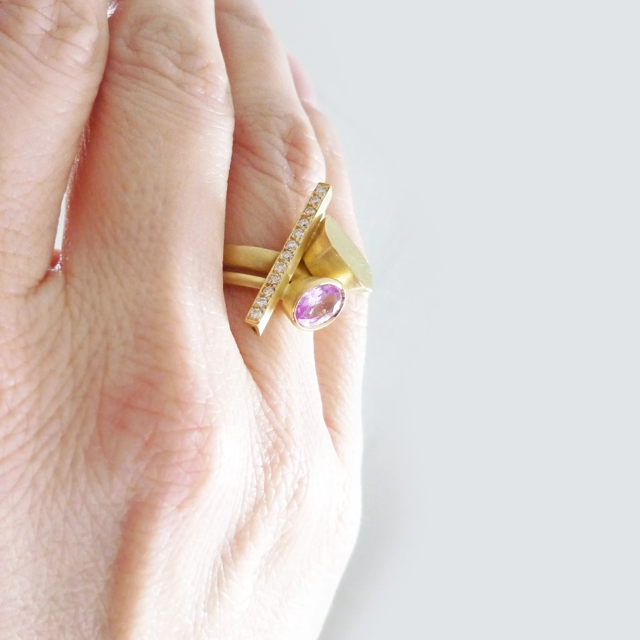 Pink sapphire and diamond and yellow gold ring