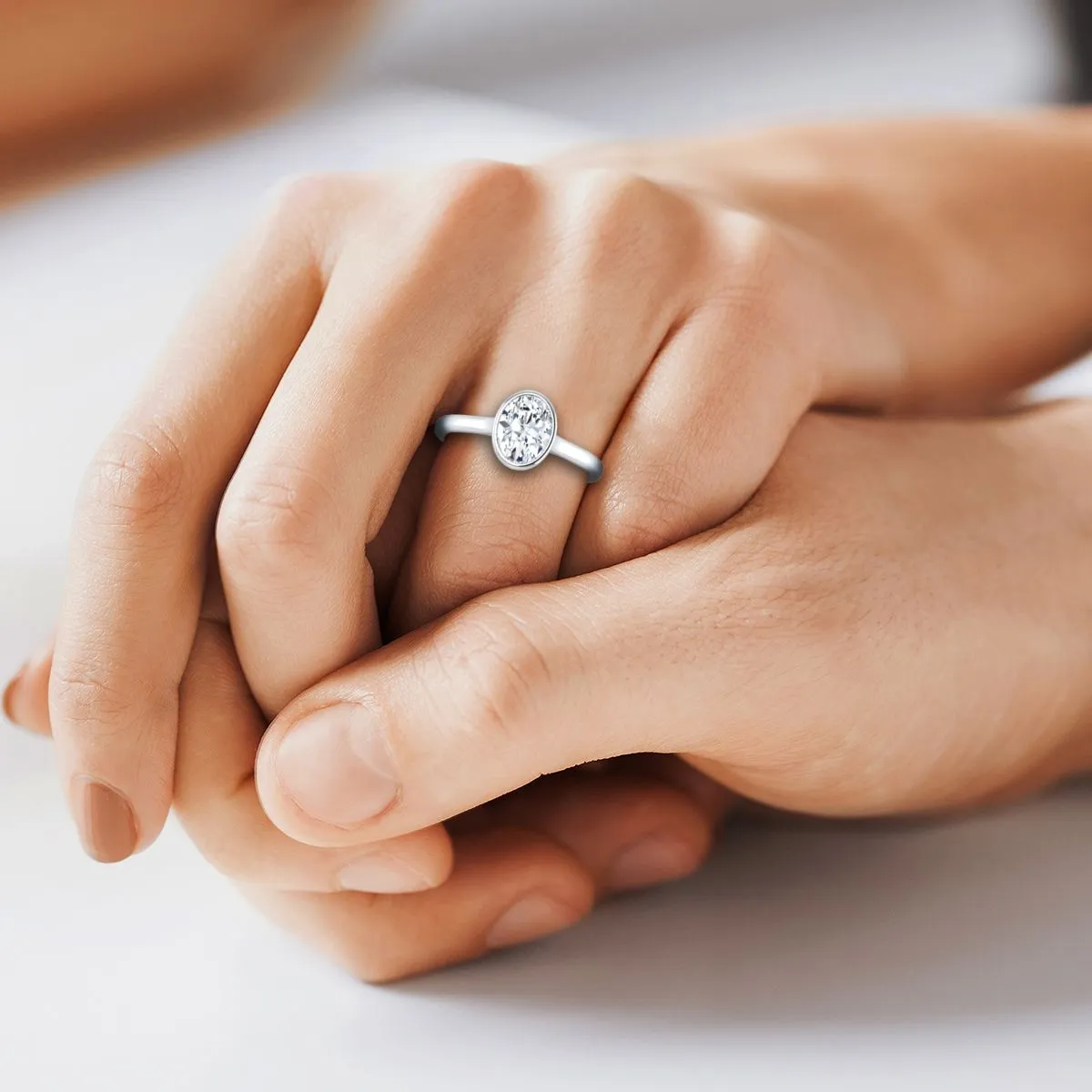 Platinum Oval Emerald Simple Bezel Solitaire Engagement Ring